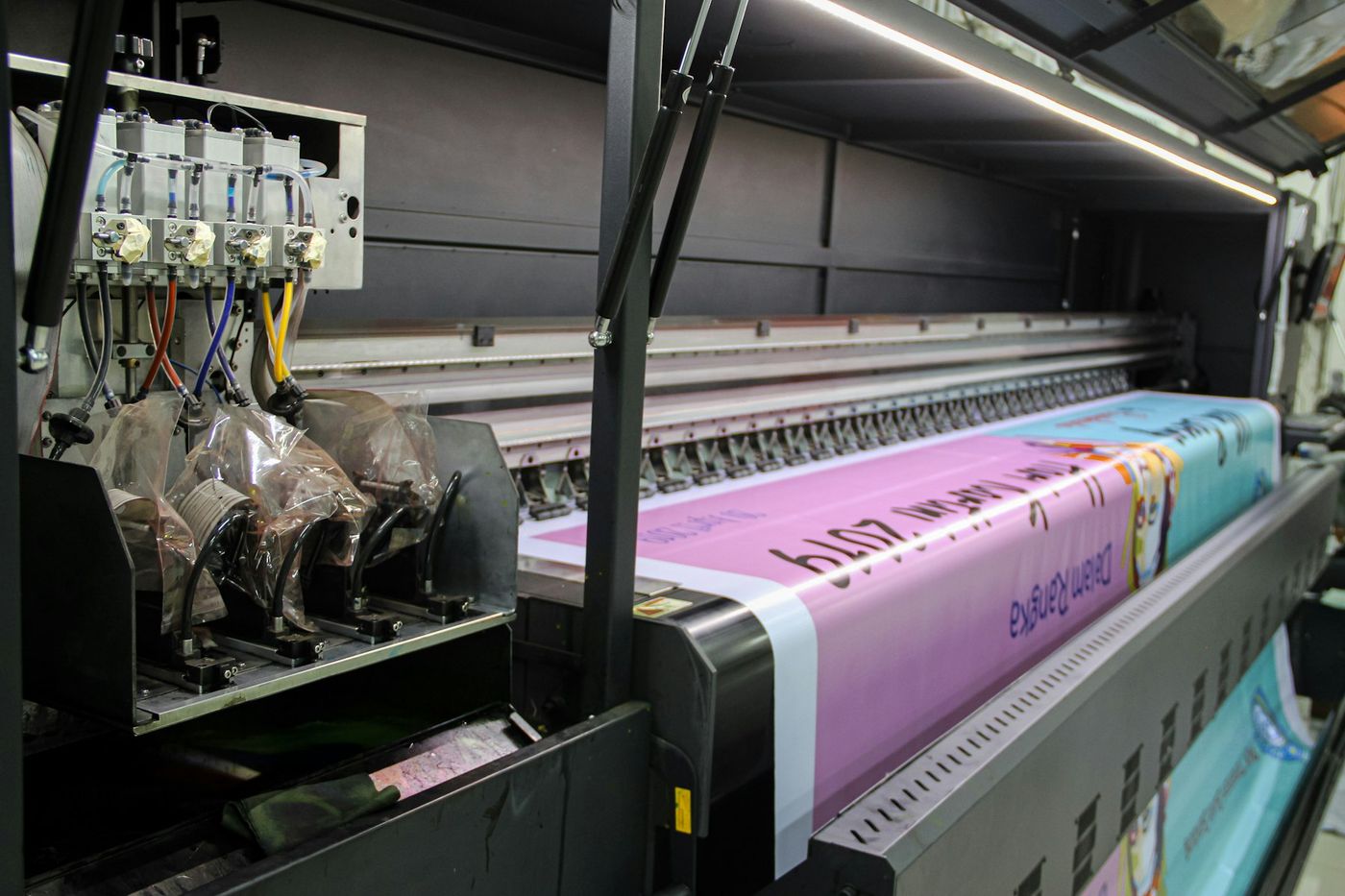 A wide format printer producing a banner